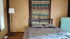 Postel nebo postele na pokoji v ubytování Kiniman Home