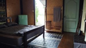 Postel nebo postele na pokoji v ubytování Kiniman Home