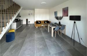 a living room with a table and a dining room at Nice Home In Stare Sady With Kitchen in Stare Sady