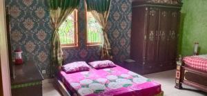 Кровать или кровати в номере Latar Amba Guest House