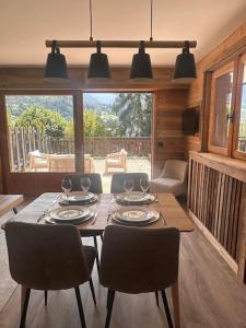 a dining room with a table and chairs in a room at Studio Cosy cœur de Megève Le Soleil Levant in Megève +7 photos