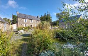 an old house in the middle of a garden at 6 Bedroom Lovely Home In Tréguier in Tréguier +24 photos