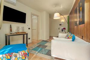 A television and/or entertainment centre at ILIA'S House Porto Rotondo