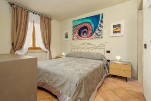A bed or beds in a room at ILIA'S House Porto Rotondo