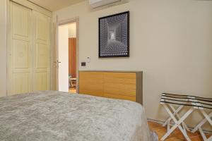 A bed or beds in a room at ILIA'S House Porto Rotondo