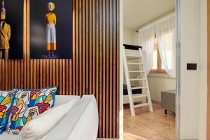 A bed or beds in a room at ILIA'S House Porto Rotondo