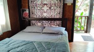 Postel nebo postele na pokoji v ubytování Kiniman Home