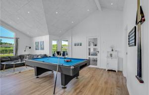 a living room with a pool table in it at Stunning Home In Hadsund With Five Bedrooms And Wifi in Hadsund