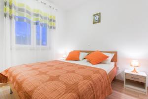 Postel nebo postele na pokoji v ubytování Apartments Srdarev Pencov