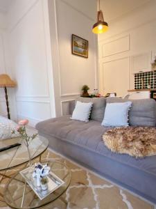 a living room with a couch and a table at Cozy apartment in Rīga