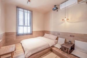 Voodi või voodid majutusasutuse 泉州西街圆石静舍民宿 toas