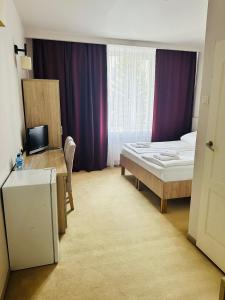 Posteľ alebo postele v izbe v ubytovaní Hotel TM