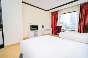 Postel nebo postele na pokoji v ubytování Kingston Hotel 5 - Chow Kit