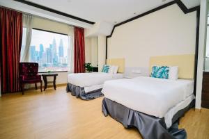 Postel nebo postele na pokoji v ubytování Kingston Hotel 5 - Chow Kit