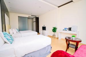 Postel nebo postele na pokoji v ubytování Kingston Hotel 5 - Chow Kit