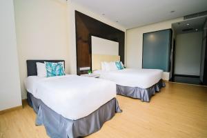 Postel nebo postele na pokoji v ubytování Kingston Hotel 5 - Chow Kit