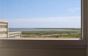 a view of the ocean from a window at Three-Bedroom Holiday Home In Hvide Sande in Havrvig