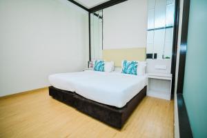 Postel nebo postele na pokoji v ubytování Kingston Hotel 5 - Chow Kit