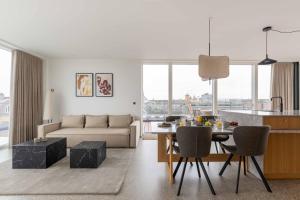 a living room with a couch and a table at Nørrebrogade 209 in Copenhagen