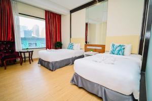 Postel nebo postele na pokoji v ubytování Kingston Hotel 5 - Chow Kit