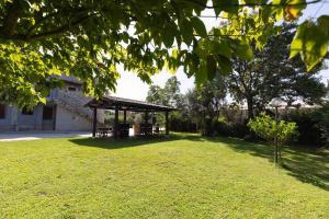 a gazebo in the middle of a yard at Affittacamere Melara in Serre +6 photos
