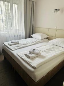 Posteľ alebo postele v izbe v ubytovaní Hotel TM