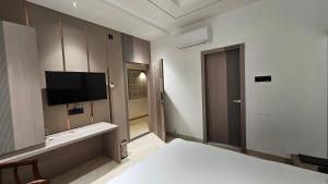 TV a/nebo společenská místnost v ubytování Hotel Grand City