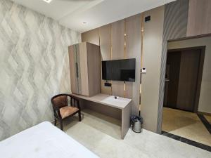 TV a/nebo společenská místnost v ubytování Hotel Grand City