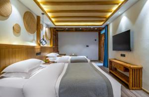 夕露古城中心店 XILU INN NANXI - Ancient City Center Branch客房内的一张或多张床位