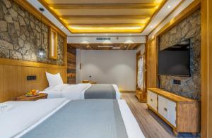 夕露古城中心店 XILU INN NANXI - Ancient City Center Branch客房内的一张或多张床位