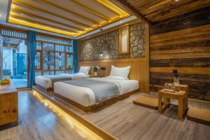 Postel nebo postele na pokoji v ubytování 夕露古城中心店 XILU INN NANXI - Ancient City Center Branch