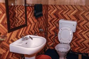 a bathroom with a sink and a toilet at Wanderlust Cottage Pangong Lake, Lukung, in Lukung