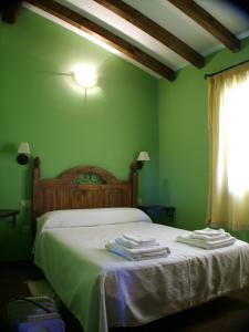Postel nebo postele na pokoji v ubytování Casas Rurales Manolo