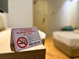Postel nebo postele na pokoji v ubytování Sky Hotel Chow Kit PWTC