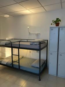 Posteľ alebo postele v izbe v ubytovaní NC Hostel