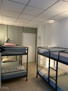 Posteľ alebo postele v izbe v ubytovaní NC Hostel