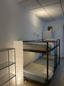 Posteľ alebo postele v izbe v ubytovaní NC Hostel