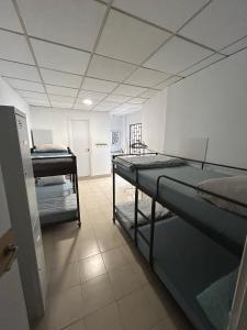 Posteľ alebo postele v izbe v ubytovaní NC Hostel