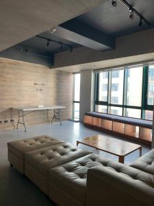 a living room with a couch and a table at 63 sqm Unit for GET TOGETHER at Poblacion, Makati with Private Parking in Manila +1 photo