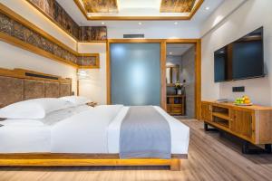 夕露古城中心店 XILU INN NANXI - Ancient City Center Branch客房内的一张或多张床位