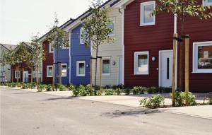 a row of colorful houses on a street at Gorgeous Home In Dagebüll With Sauna in Dagebüll