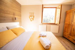 Postel nebo postele na pokoji v ubytování Maison Foppolo A due passi dalla Funivia