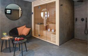 a room with a shower with a chair and a mirror at Villa Casa Cupra in Umag +51 photos