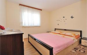 Postel nebo postele na pokoji v ubytování Holiday Home Kakma V