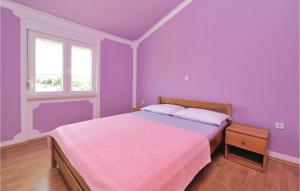 Postel nebo postele na pokoji v ubytování Holiday Home Kakma V