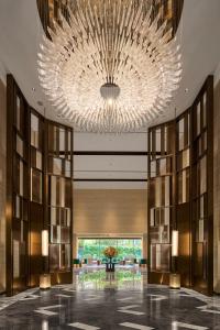 a large chandelier in the lobby of a hotel at InterContinental Taichung by IHG in Taichung