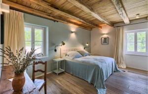 a bedroom with a bed and two windows at Villa Catalpa in Poreč +51 photos