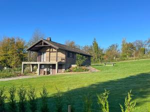 a house on a hill with a green field at Pré Vert in Durbuy
