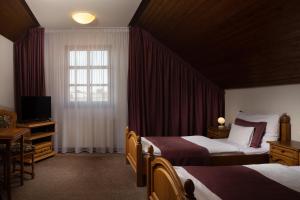 Posteľ alebo postele v izbe v ubytovaní OREA Hotel Arigone Olomouc