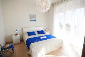 A bed or beds in a room at Appartamento Bellariva B2 - MyHo Casa